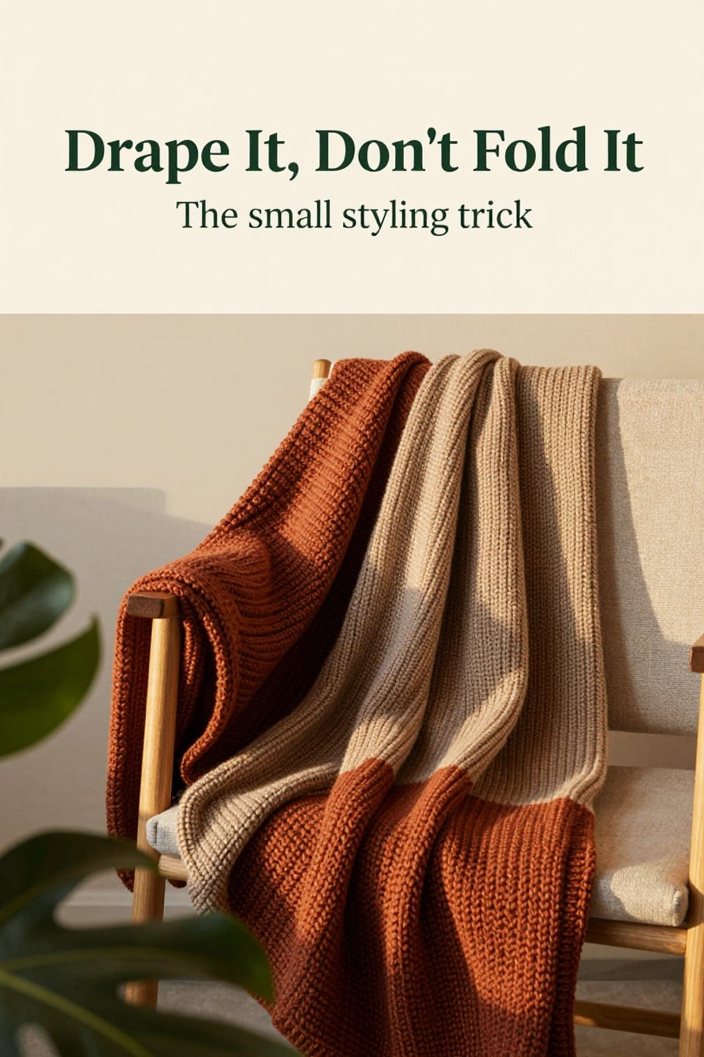 Chunky knit throw draped over the arm of a balcony reading chair