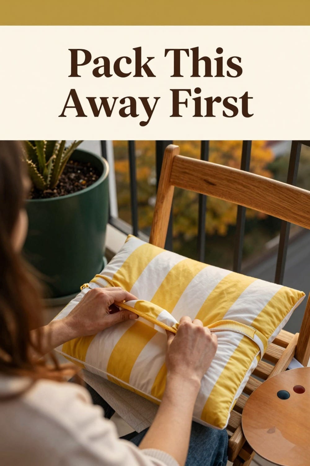 Hands bagging a bright summer cushion cover before the fall cushion swap on a small balcony